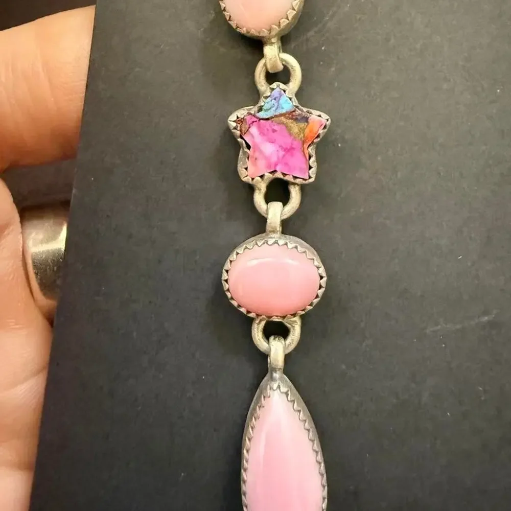 Beautiful handmade long sterling silver pink conch earrings